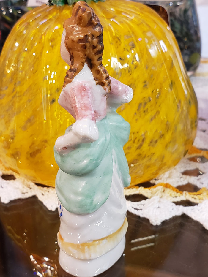 Buxom victorian lady figurine