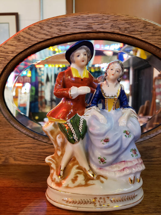 Porcelain figurine of Senior Victorian Man & Woman
